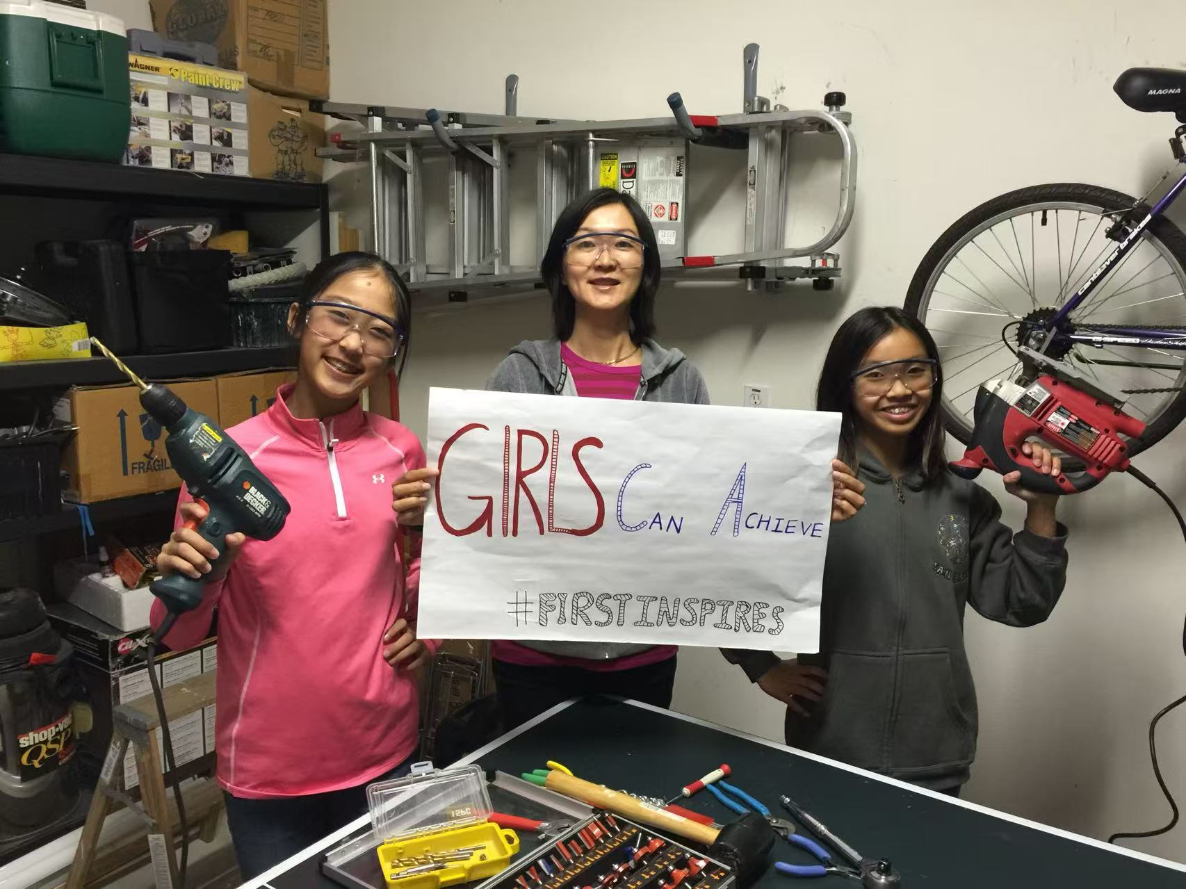 Coach Olivia mentoring students who built robots, 'Girls Can Achieve'